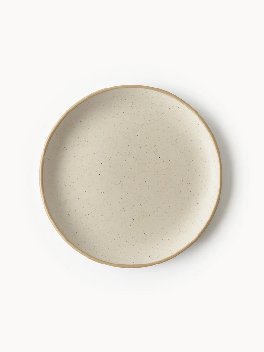 A top-down view of a round stoneware plate featuring a speckled cream finish and a natural brown rim.