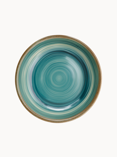 A top-down view of a round ceramic plate featuring a glossy teal and turquoise glaze with concentric swirl patterns and a brown rim.