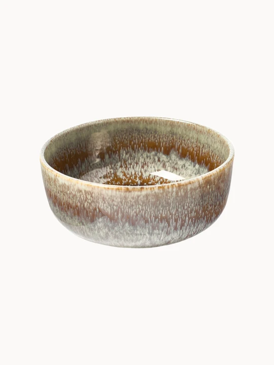 A round ceramic bowl with a glossy glaze featuring an earthy brown color dripping down into a textured, light beige and grey finish, on a plain white background.