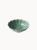 A small, sage green ceramic bowl designed in the shape of a blooming flower,  finished with a smooth glossy glaze, isolated on a plain white background.