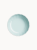 A top-down view on a pastel blue ceramic cake stand, on a light background.