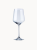 A single clear wine glass with a long stem, isolated on a light background.